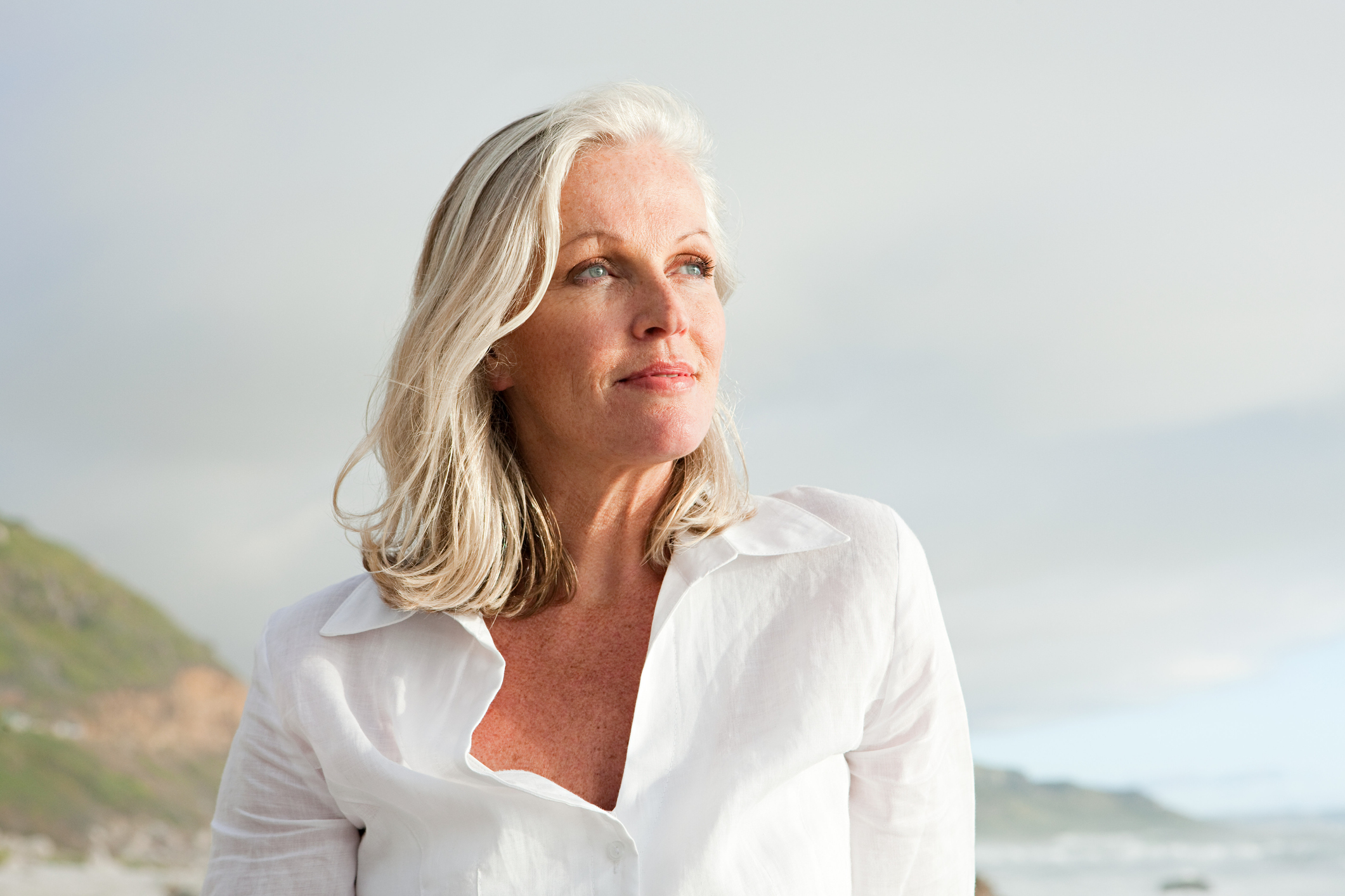 Woman with white hair at the beach